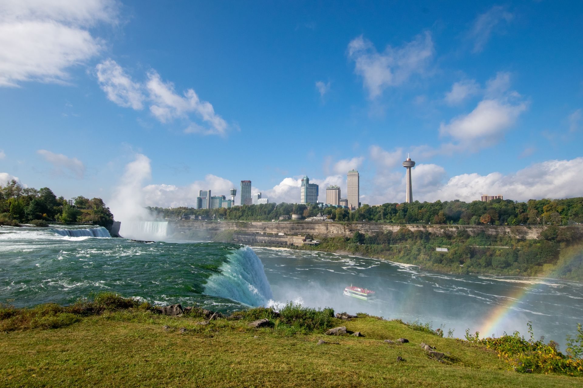 The Niagara River and Falls seen with a rainbow in the spray